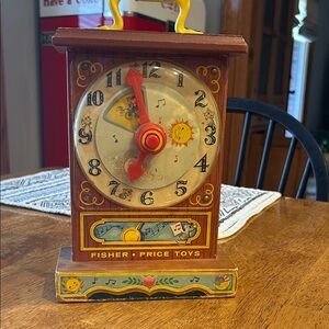 Fisher-Price Vintage Musical Clock with Red and Brown Details